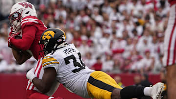 Wisconsin wide receiver Will Pauling (6) is tackled short of a first down by Iowa linebacker Jay Higgins (34) during the second quarter of their game Saturday, October 14, 2023 at Camp Randall Stadium in Madison, Wisconsin.
