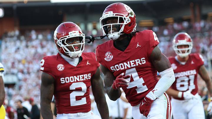 Sep 6, 2025; Norman, Oklahoma, USA; Oklahoma Sooners wide receiver Deion Burks (4) celebtrates with running back Jovantae Barnes (2) after scoring a touchdown against the Michigan Wolverines during the first half at Gaylord Family-Oklahoma Memorial Stadium. Mandatory Credit: Kevin Jairaj-Imagn Images