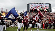 Oct 26, 2024; Blacksburg, Virginia, USA; Virginia Tech Hokies head coach Brent Pry runs onto the field before playing against the Georgia Tech Yellow Jackets at Lane Stadium. Mandatory Credit: Peter Casey-Imagn Images