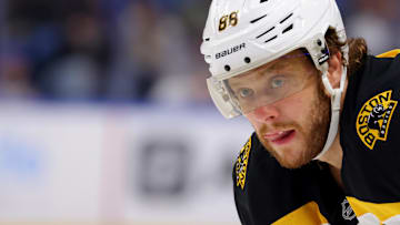 Apr 6, 2025; Buffalo, New York, USA;  Boston Bruins right wing David Pastrnak (88) waist for the face-off during the first period against the Buffalo Sabres at KeyBank Center. Mandatory Credit: Timothy T. Ludwig-Imagn Images