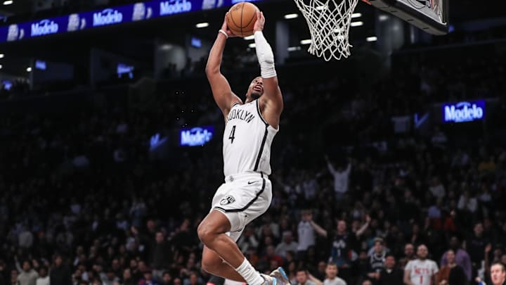 Mar 5, 2024; Brooklyn, New York, USA;  Brooklyn Nets guard Dennis Smith Jr. (4) goes up for a dunk in the fourth quarter against the Philadelphia 76ers at Barclays Center. Mandatory Credit: Wendell Cruz-Imagn Images