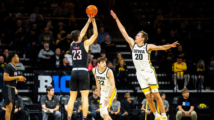 Iowa forward Payton Sandfort (20) defends as Omaha forward Frankie Fidler (23) shoots a 3-point basket during a NCAA men's basketball game, Monday, Nov. 21, 2022, at Carver-Hawkeye Arena in Iowa City, Iowa.

221121 Omaha Iowa Mbb 010 Jpg