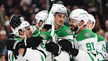 Oct 24, 2024; Boston, Massachusetts, USA;  Dallas Stars center Logan Stankoven (11) is mobbed by his teammates after scoring a goal during the second period against the Boston Bruins at TD Garden. Mandatory Credit: Bob DeChiara-Imagn Images