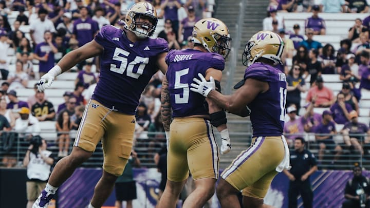 Zach Durfee (5) shares in a sack with Sebastian Valdez and Alphonzo Tuputala.