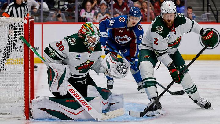 May 13, 2026; Denver, Colorado, USA; Minnesota Wild goaltender Jesper Wallstedt (30) makes a save as defenseman Jeff Petry (2) defends and Colorado Avalanche left wing Joel Kiviranta (94) looks on in overtime in game five of the second round of the 2026 Stanely Cup Playoffs at Ball Arena. Mandatory Credit: Isaiah J. Downing-Imagn Images