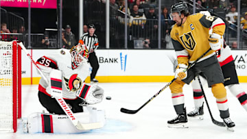 Nov 26, 2025; Las Vegas, Nevada, USA; Ottawa Senators goaltender Linus Ullmark (35) makes a save as Vegas Golden Knights right wing Mark Stone (61) attempts a deflection during the first period at T-Mobile Arena. Mandatory Credit: Stephen R. Sylvanie-Imagn Images