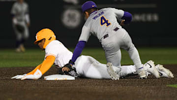 LSU's Steven Milam (4) tags Tennessee's Christian Moore (1) out during a NCAA baseball game at Lindsey Nelson Stadium on Friday, April 12, 2024. Tennessee won 6-3 against LSU.