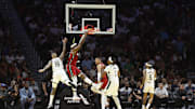 Nov 26, 2025; Miami, Florida, USA; Miami Heat center Bam Adebayo (13) dunks against the Milwaukee Bucks during the first half of an NBA Cup game at Kaseya Center. Mandatory Credit: Rhona Wise-Imagn Images