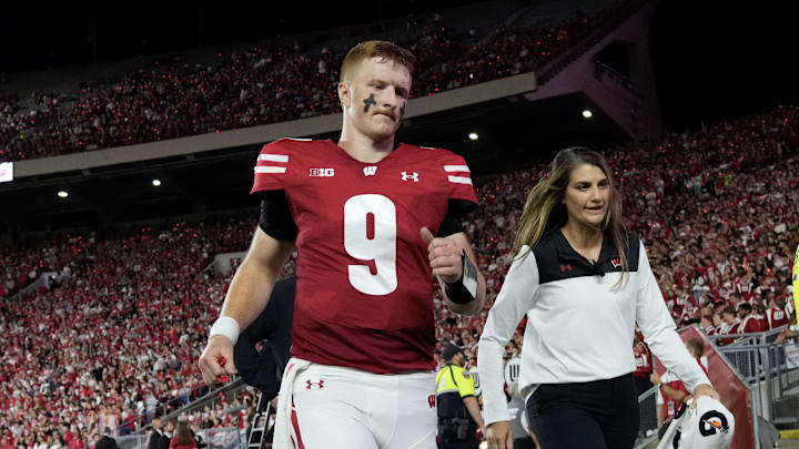 Aug 28, 2025; Madison, Wisconsin, USA;  Wisconsin Badgers quarterback Billy Edwards Jr. (9) walks to the locker room after being injured during the second quarter against the Miami (OH) RedHawks at Camp Randall Stadium. Mandatory Credit: Jeff Hanisch-Imagn Images