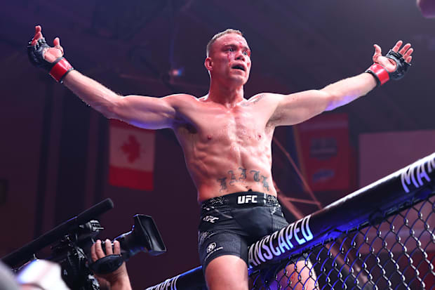 Nate Landwehr (red gloves) celebrates after defeating Jamall Emmers (not pictured) during UFC Fight Night at Boardwalk Hall. 