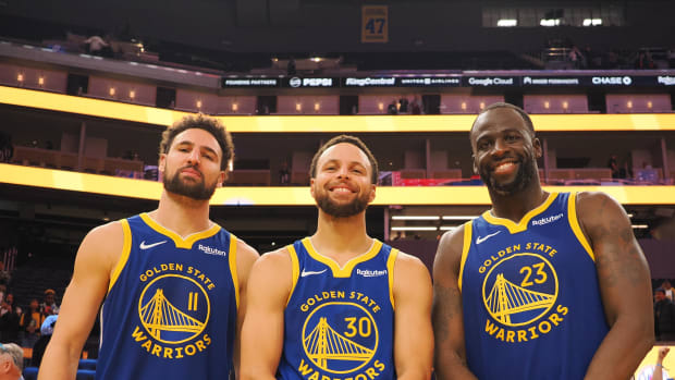 Nov 30, 2023; San Francisco, California, USA; Golden State Warriors guard Klay Thompson (11), guard Stephen Curry (30) and forward Draymond Green (23) after the game against the Los Angeles Clippers at Chase Center. Mandatory Credit: Kelley L Cox-USA TODAY Sports