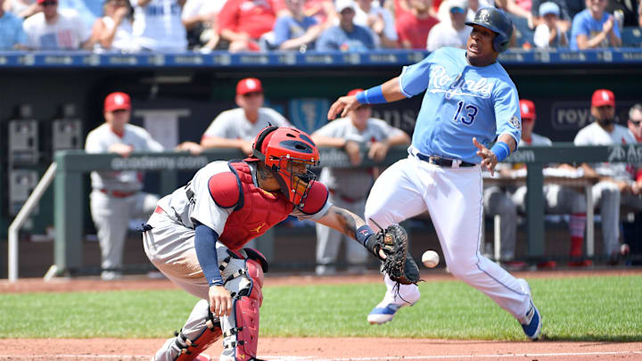 Aug 12, 2018; Kansas City, MO, USA; St. Louis Cardinals catcher Yadier Molina (4) gets the throw as Kansas City Royals catcher Salvador Perez (13) prepares to slide into home plate in the third inning at Kauffman Stadium. Mandatory Credit: Denny Medley-Imagn Images