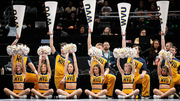 Mar 8, 2026; Kansas City, MO, USA; West Virginia Mountaineers cheerleaders during the second half against the TCU Horned Frogs at T-Mobile Center. Mandatory Credit: William Purnell-Imagn Images