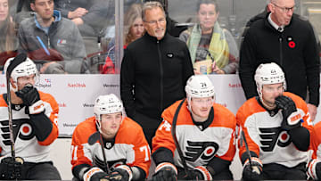 Nov 7, 2023; San Jose, California, USA; Philadelphia Flyers head coach John Tortorella watches the play against the San Jose Sharks from the bench during the third period at SAP Center at San Jose. Mandatory Credit: Robert Edwards-Imagn Images