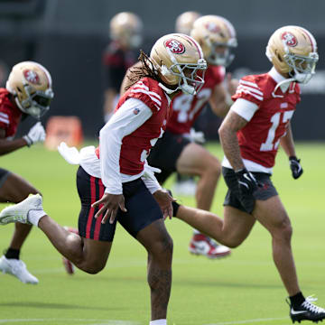 Jul 23, 2025; Santa Clara, CA, USA; San Francisco 49ers offensive backs and receivers run wind sprints during the first day of training camp at SAP Performance Facility. Mandatory Credit: D. Ross Cameron-Imagn Images