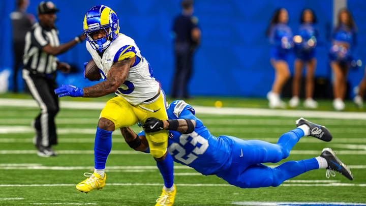 Los Angeles Rams running back Kyren Williams (23) is wrapped up by Detroit Lions cornerback Carlton Davis III (23) during the first half of the Detroit Lions season opener against the Los Angeles Rams at Ford Field in Detroit, on Sunday, Sept. 8. 2024.