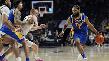 Feb 1, 2025; Winston-Salem, North Carolina, USA; Pittsburgh Panthers guard Damian Dunn (1) drives to the basket defended by Wake Forest Demon Deacons guard Cameron Hildreth (6) during the second half at Lawrence Joel Veterans Memorial Coliseum. Mandatory Credit: Jim Dedmon-Imagn Images