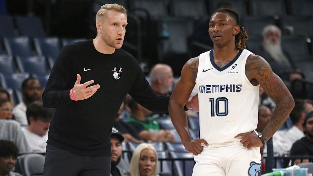 Oct 8, 2025; Memphis, Tennessee, USA; Memphis Grizzlies head coach Tuomas Iisalo talks with Memphis Grizzlies guard Javon Small (10) during the third quarter against the Boston Celtics at FedExForum. Mandatory Credit: Petre Thomas-Imagn Images