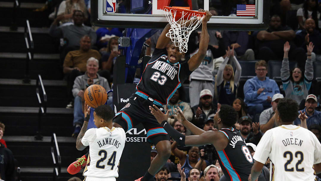 Oct 22, 2025; Memphis, Tennessee, USA; Memphis Grizzlies forward Cedric Coward (23) dunks during the fourth quarter against the New Orleans Pelicans at FedExForum. Mandatory Credit: Petre Thomas-Imagn Images