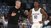 Oct 8, 2025; Memphis, Tennessee, USA; Memphis Grizzlies head coach Tuomas Iisalo talks with Memphis Grizzlies guard Javon Small (10) during the third quarter against the Boston Celtics at FedExForum. Mandatory Credit: Petre Thomas-Imagn Images