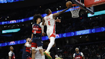 Jan 7, 2025; Washington, District of Columbia, USA; Houston Rockets guard Jalen Green (4) shoots the ball as Washington Wizards forward Kyshawn George (18) defends in the third quarter at Capital One Arena. Mandatory Credit: Geoff Burke-Imagn Images