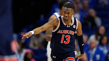 Mar 1, 2025; Lexington, Kentucky, USA; Auburn Tigers guard Miles Kelly (13) celebrates after making a three point basket during the second half against the Kentucky Wildcats at Rupp Arena at Central Bank Center. Mandatory Credit: Jordan Prather-Imagn Images
