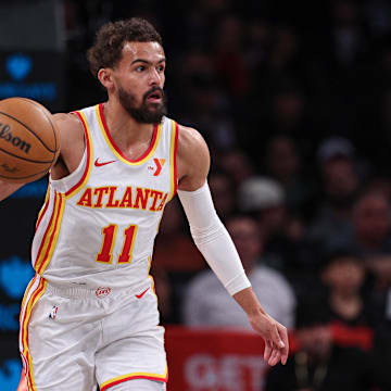 Mar 16, 2025; Brooklyn, New York, USA; Atlanta Hawks guard Trae Young (11) dribbles up court during the first quarter against the Brooklyn Nets at Barclays Center. Mandatory Credit: Vincent Carchietta-Imagn Images