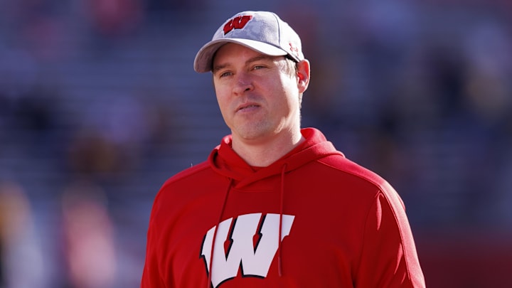 Nov 26, 2022; Madison, Wisconsin, USA;  Wisconsin Badgers head coach Jim Leonhard looks on during warmups prior to the game against the Minnesota Golden Gophers at Camp Randall Stadium. Mandatory Credit: Jeff Hanisch-Imagn Images