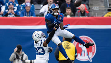 New York Giants wide receiver Malik Nabers (1) catches a pass in the air while being guarded by Indianapolis Colts defensive back Kenny Moore II (23) during a game between New York Giants and Indianapolis Colts at MetLife Stadium on Sunday, Dec. 29, 2024.