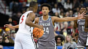 Mar 22, 2024; Spokane, WA, USA; UAB Blazers guard Efrem Johnson (24) defends San Diego State Aztecs guard Lamont Butler (5) during the second half in the first round of the 2024 NCAA Tournament at Spokane Veterans Memorial Arena. 