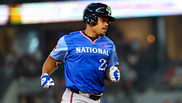 Jul 13, 2024; Arlington, TX, USA;  National League Future  catcher Drake Baldwin (21) hits a home run during the sixth inning against the American League Future team during the Major league All-Star Futures game at Globe Life Field.  Mandatory Credit: Kevin Jairaj-Imagn Images