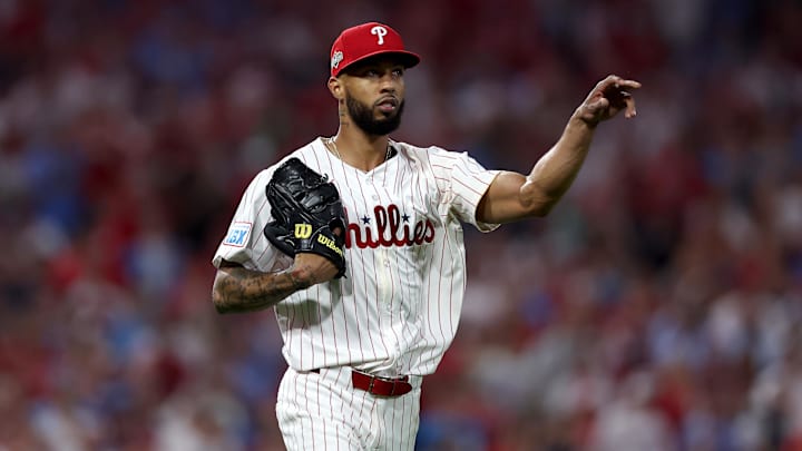 Oct 4, 2025; Philadelphia, Pennsylvania, USA; Philadelphia Phillies pitcher Cristopher Sanchez (61) throws to first for an out against the Los Angeles Dodgers in the fourth inning during game one of the NLDS round for the 2025 MLB playoffs at Citizens Bank Park. 