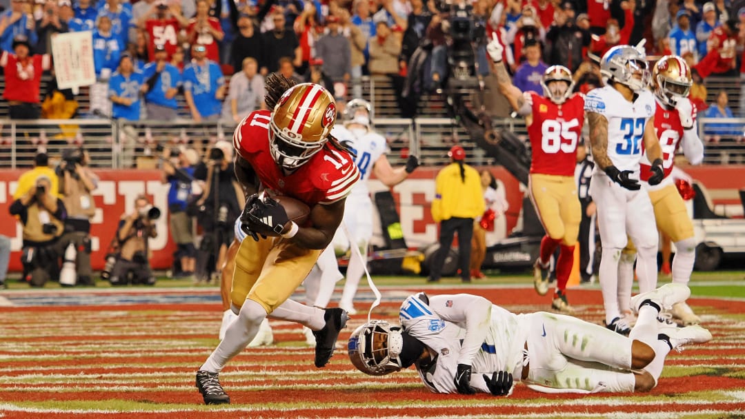 Jan 28, 2024; Santa Clara, California, USA; San Francisco 49ers wide receiver Brandon Aiyuk (11) makes a catch for a touchdown against the Detroit Lions during the second half of the NFC Championship football game at Levi's Stadium. Mandatory Credit: Kelley L Cox-USA TODAY Sports