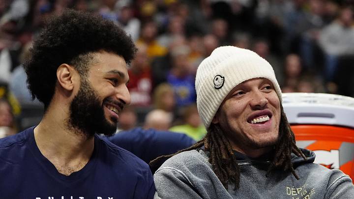 Feb 3, 2025; Denver, Colorado, USA; Denver Nuggets forward Aaron Gordon (32) and guard Jamal Murray (27) on the bench in the second half against the New Orleans Pelicans at Ball Arena. Mandatory Credit: Ron Chenoy-Imagn Images