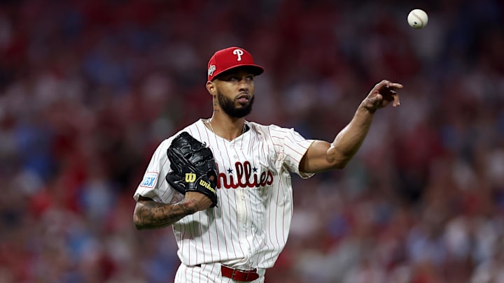Oct 4, 2025; Philadelphia, Pennsylvania, USA; Philadelphia Phillies pitcher Cristopher Sanchez (61) throws to first for an out against the Los Angeles Dodgers in the fourth inning during game one of the NLDS round for the 2025 MLB playoffs at Citizens Bank Park. 