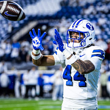 BYU DE Ephraim Asiata warms up for game against Kansas State 