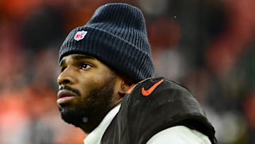 Dec 7, 2025; Cleveland, Ohio, USA; Cleveland Browns quarterback Shedeur Sanders (12) watches from the sidelines late in the fourth quarter against the Tennessee Titans at Huntington Bank Field. Mandatory Credit: Ken Blaze-Imagn Images