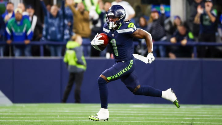 Aug 24, 2024; Seattle, Washington, USA; Seattle Seahawks wide receiver Dee Eskridge (1) returns a punt for a touchdown against the Cleveland Browns during the second quarter at Lumen Field.