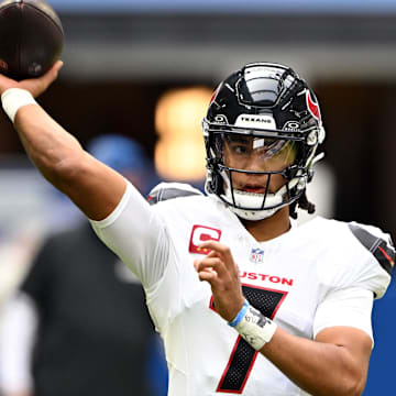 Sep 8, 2024; Indianapolis, Indiana, USA; Houston Texans quarterback C.J. Stroud (7) throws a pass to warm up before the game against the Indianapolis Colts at Lucas Oil Stadium. Mandatory Credit: Marc Lebryk-Imagn Images