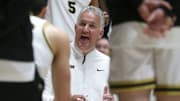 Purdue Boilermakers head coach Matt Painter leads a team huddle 