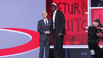 Jun 25, 2025; Brooklyn, NY;  Khaman Maluach stands with NBA commissioner Adam Silver during the first round of the 2025 NBA Draft
