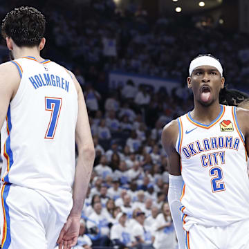 Apr 21, 2024; Oklahoma City, Oklahoma, USA; Oklahoma City Thunder guard Shai Gilgeous-Alexander (2) reacts to forward Chet Holmgren (7) blocking a shot by a New Orleans Pelicans player during the second quarter of game one of the first round for the 2024 NBA playoffs at Paycom Center. Mandatory Credit: Alonzo Adams-Imagn Images
