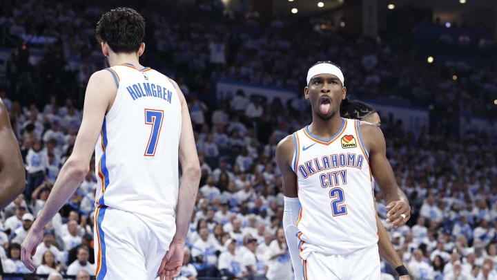 Apr 21, 2024; Oklahoma City, Oklahoma, USA; Oklahoma City Thunder guard Shai Gilgeous-Alexander (2) reacts to forward Chet Holmgren (7) blocking a shot by a New Orleans Pelicans player during the second quarter of game one of the first round for the 2024 NBA playoffs at Paycom Center. Mandatory Credit: Alonzo Adams-USA TODAY Sports