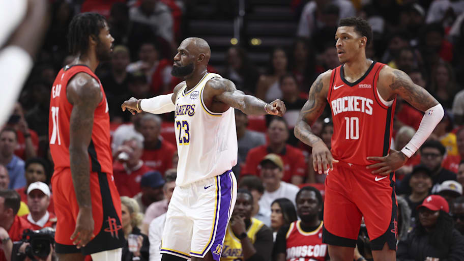 Los Angeles Lakers forward LeBron James reacts after a play as Houston Rockets forward Jabari Smith Jr. looks on.