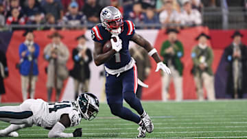 Aug 15, 2024; Foxborough, MA, USA; New England Patriots wide receiver Ja'Lynn Polk (1)  runs the ball against the Philadelphia Eagles during the first half at Gillette Stadium. Mandatory Credit: Eric Canha-Imagn Images