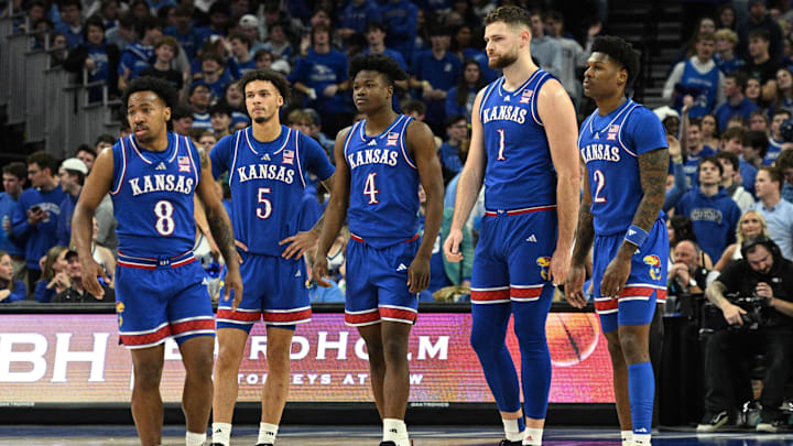 Dec 4, 2024; Omaha, Nebraska, USA; Kansas Jayhawks guard David Coit (8) and guard Dajuan Harris Jr. (3) and guard Rakease Passmore (4) and center Hunter Dickinson (1) and guard AJ Storr (2) on the floor against the Creighton Bluejays during the first half at CHI Health Center Omaha. Mandatory Credit: Steven Branscombe-Imagn Images