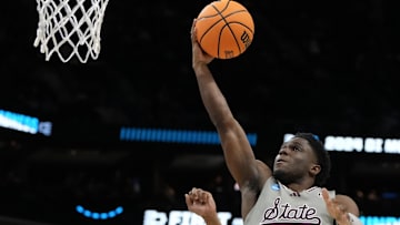 March 21, 2024, Charlotte, NC, USA;  Mississippi State Bulldogs guard Josh Hubbard (13) shoots against Michigan State Spartans guard Jaden Akins (3) in the first round of the 2024 NCAA Tournament at the Spectrum Center. Mandatory Credit: Bob Donnan-Imagn Images