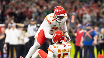 Feb 9, 2025; New Orleans, LA, USA;  Kansas City Chiefs offensive tackle Jawaan Taylor (74) helps up quarterback Patrick Mahomes (15) against the Philadelphia Eagles in Super Bowl LIX at Ceasars Superdome. Mandatory Credit: Mark J. Rebilas-Imagn Images
