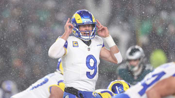 Jan 19, 2025; Philadelphia, Pennsylvania, USA; Los Angeles Rams quarterback Matthew Stafford (9) calls a play from the line of scrimmage in the third quarter against the Philadelphia Eagles in a 2025 NFC divisional round game at Lincoln Financial Field. Mandatory Credit: Bill Streicher-Imagn Images