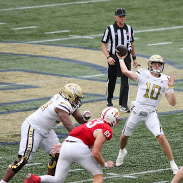 Sep 14, 2024; Atlanta, Georgia, USA; Georgia Tech Yellow Jackets quarterback Haynes King (10) throws a touchdown pass against the Virginia Military Institute Keydets in the second quarter at Bobby Dodd Stadium at Hyundai Field. Mandatory Credit: Brett Davis-Imagn Images